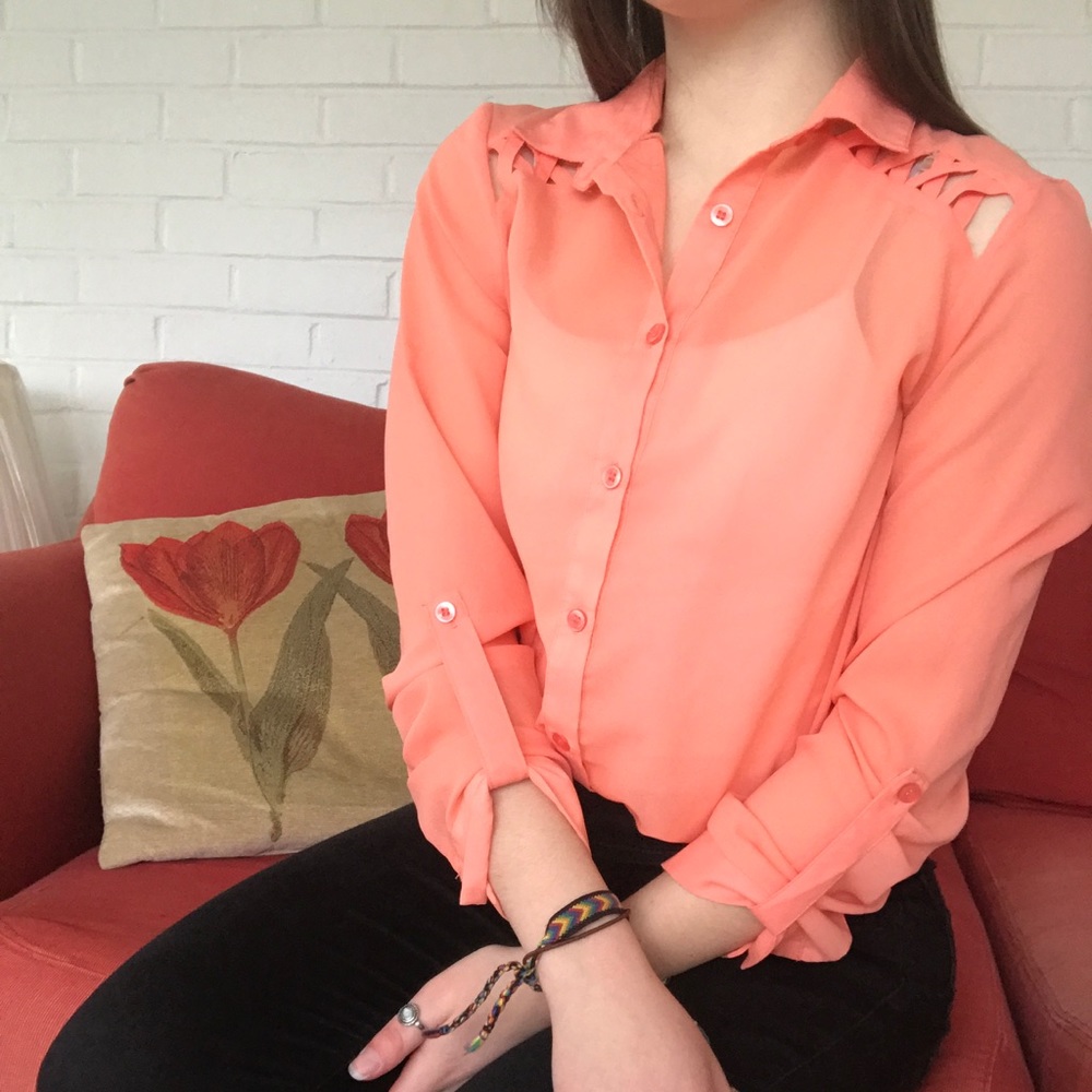 Peach colored blouse with cross cross pattern